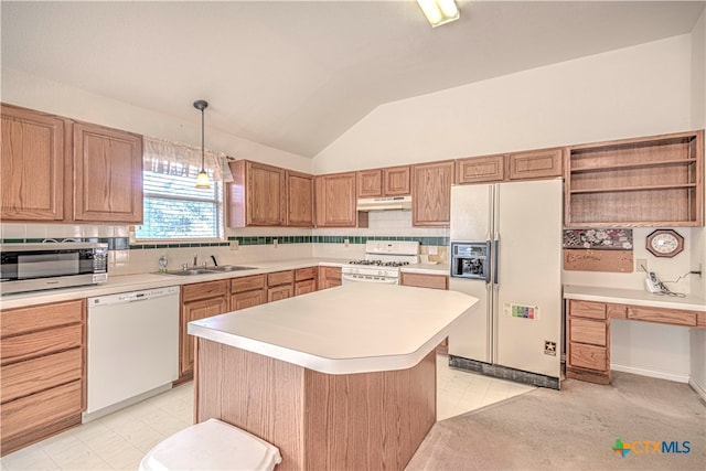 kitchen featuring vaulted ceiling, hanging light fixtures, sink, a kitchen island, and white appliances