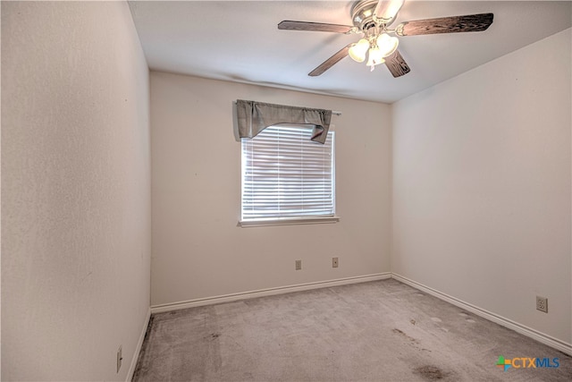 empty room with light colored carpet and ceiling fan