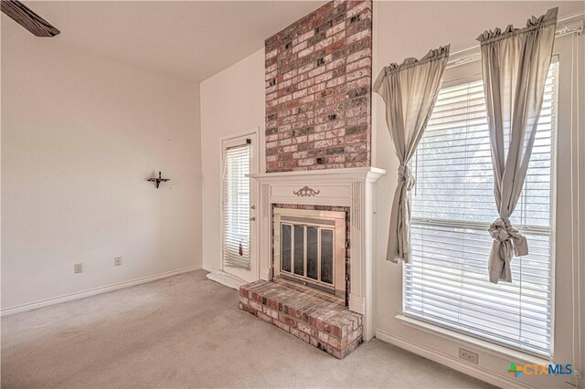 614 Sabine Cir, Temple, TX 76504 - unfurnished living room featuring carpet, a fireplace, and baseboards