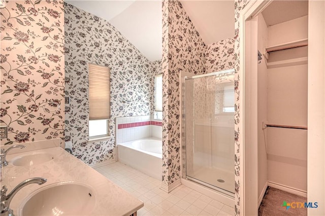 614 Sabine Cir, Temple, TX 76504 - full bathroom with wallpapered walls, a garden tub, a stall shower, double vanity, and tile patterned floors