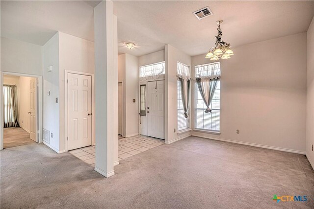 614 Sabine Cir, Temple, TX 76504 - foyer entrance featuring carpet floors, a chandelier, baseboards, and tile patterned flooring