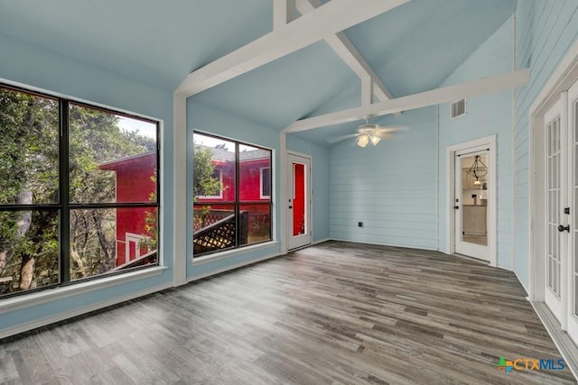 unfurnished sunroom featuring lofted ceiling, a ceiling fan, visible vents, and french doors