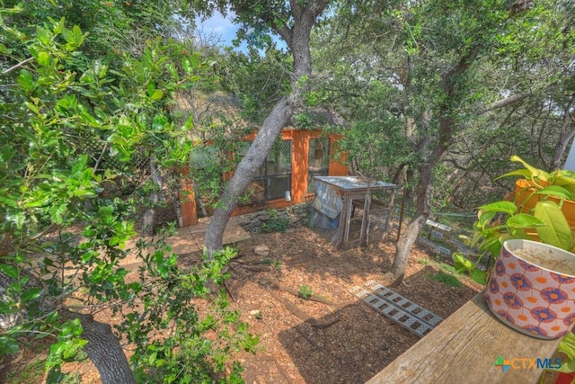 view of yard with an outdoor structure and exterior structure