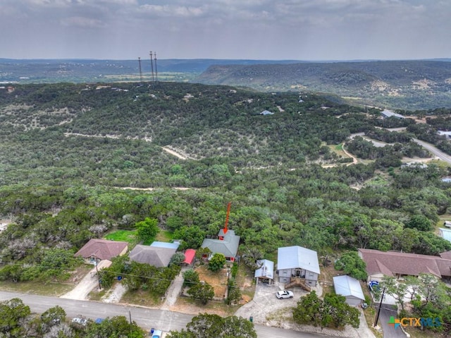 drone / aerial view featuring a view of trees