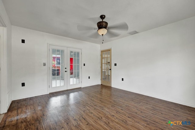 spare room with a ceiling fan, wood finished floors, visible vents, baseboards, and french doors