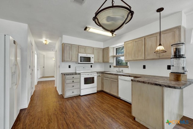 kitchen with white appliances, a sink, light brown cabinetry, dark wood-type flooring, and dark countertops