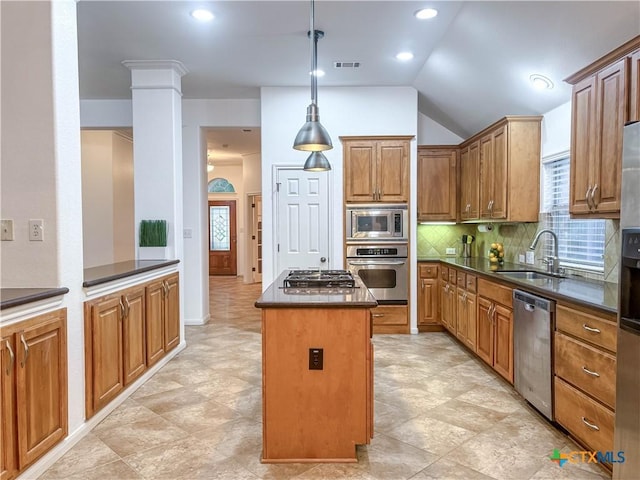 715 S Frontier Ln, Cedar Park, TX 78613 - kitchen with stainless steel appliances, a sink, a center island, dark countertops, and decorative backsplash