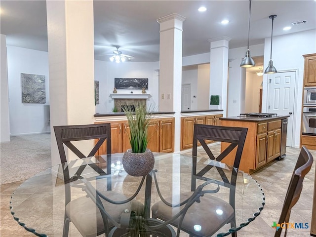 dining space featuring visible vents, light carpet, recessed lighting, ceiling fan, and ornate columns