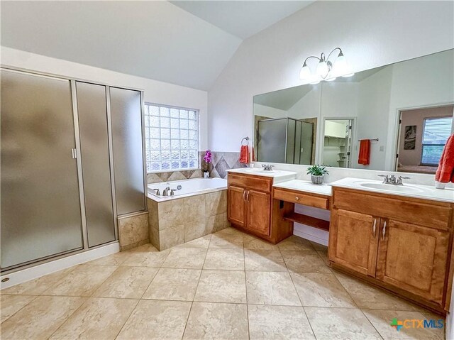 715 S Frontier Ln, Cedar Park, TX 78613 - full bathroom with lofted ceiling, double vanity, healthy amount of natural light, a shower stall, and a bath