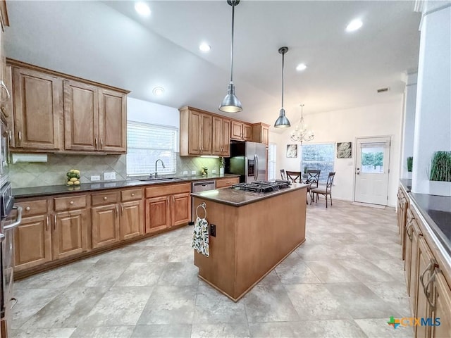 715 S Frontier Ln, Cedar Park, TX 78613 - kitchen featuring a sink, appliances with stainless steel finishes, dark countertops, a kitchen island, and decorative backsplash