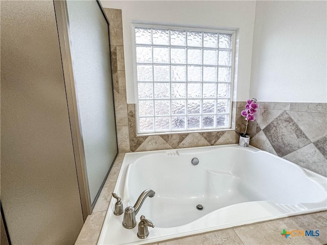 bathroom with a garden tub