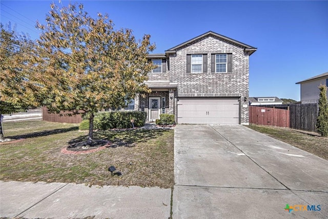 traditional-style house with concrete driveway, an attached garage, fence, and brick siding