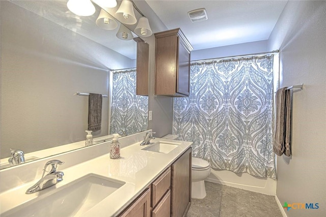 full bathroom with shower / bath combination with curtain, vanity, and toilet