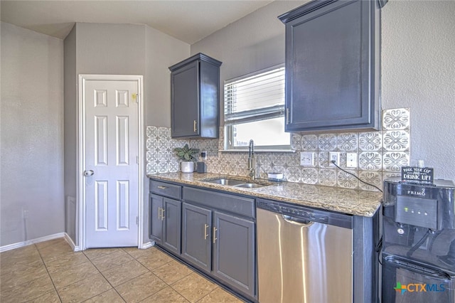 kitchen with light tile patterned flooring, a sink, baseboards, decorative backsplash, and dishwasher