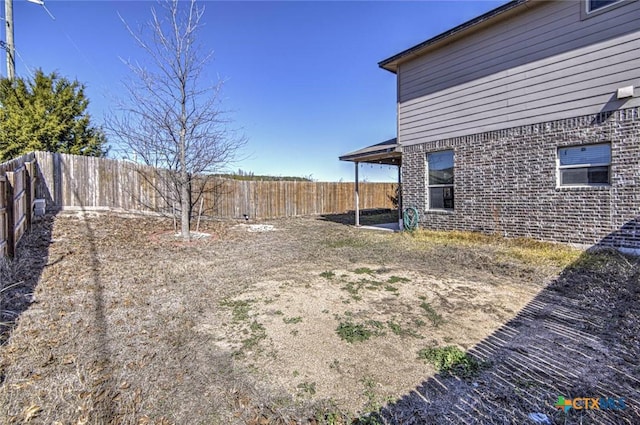 view of yard with a fenced backyard