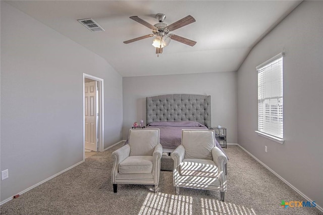 bedroom with ceiling fan, carpet floors, and vaulted ceiling