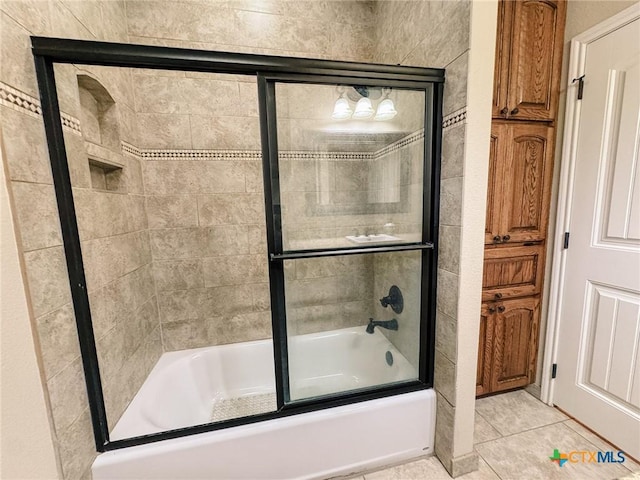 bathroom featuring tile patterned floors and enclosed tub / shower combo