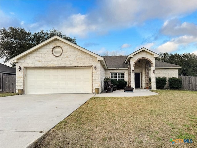 ranch-style house featuring a garage and a front yard