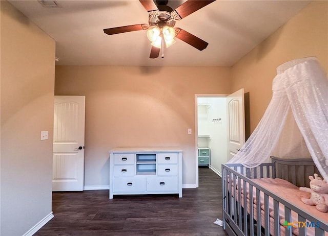 bedroom with dark wood-type flooring and ceiling fan