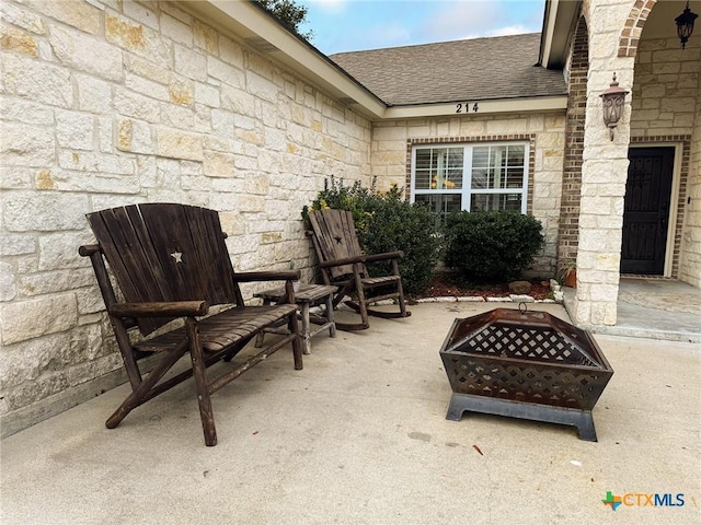 view of patio / terrace featuring a fire pit