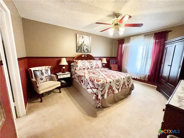 403 Suzie St, Killeen, TX 76542 - bedroom with carpet, a textured ceiling, and ceiling fan