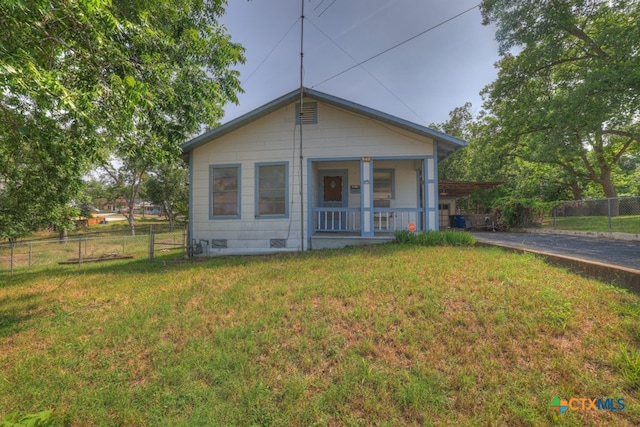 bungalow-style house with a porch and a front yard