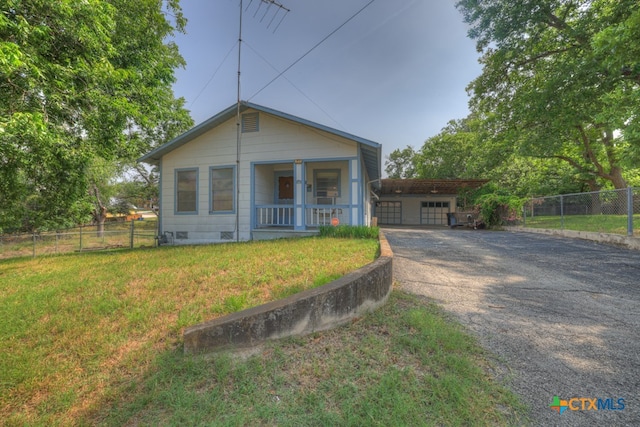 view of front of home with a porch and a front lawn