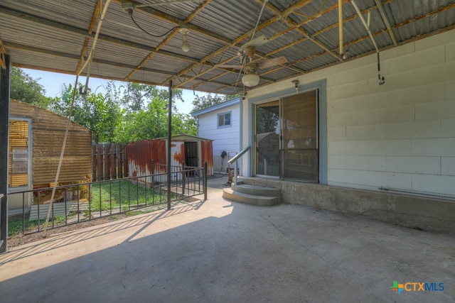 view of patio featuring a storage shed