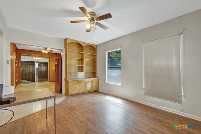 interior space with hardwood / wood-style flooring and ceiling fan