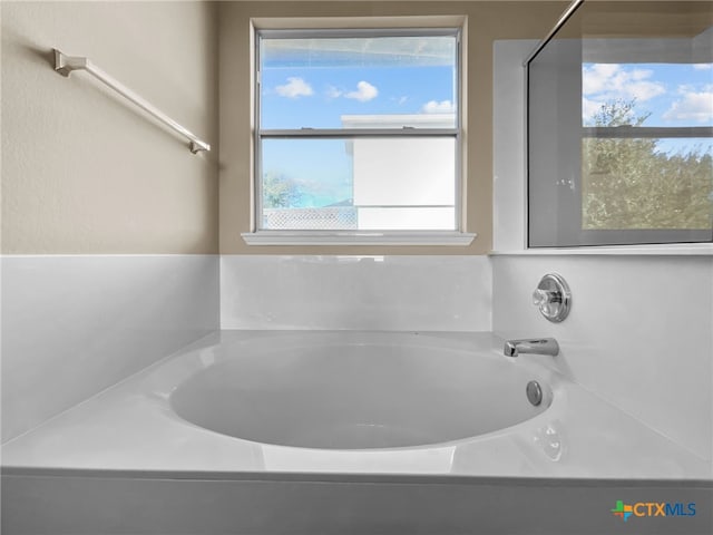 bathroom with a tub