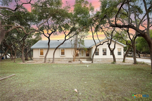 view of front of house with a lawn