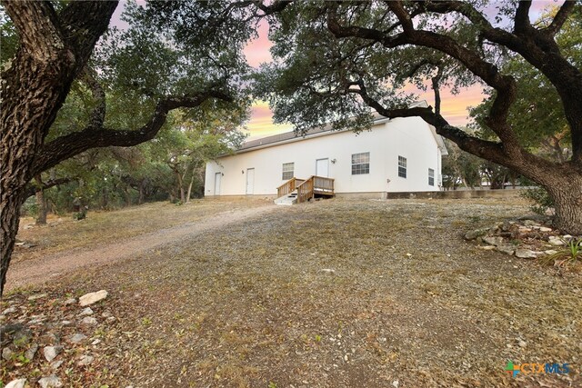 view of property exterior at dusk