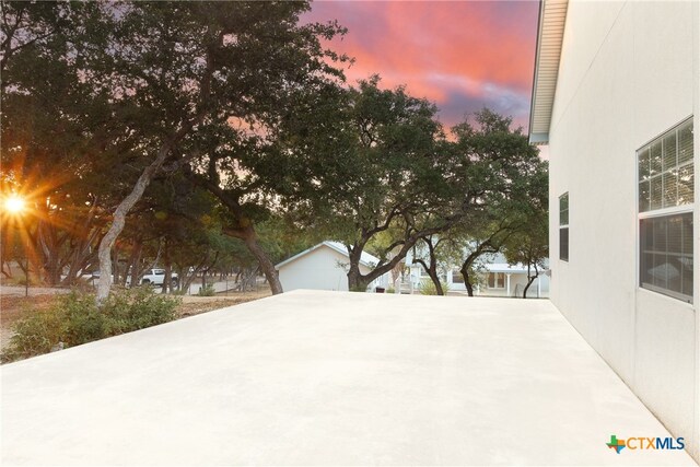 view of patio terrace at dusk