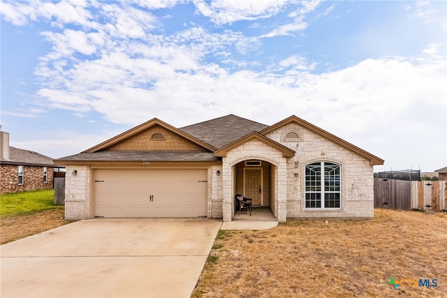 ranch-style house featuring a garage