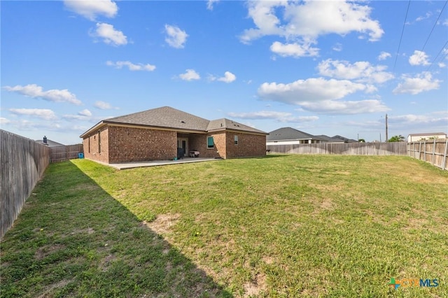 view of yard with a patio and a fenced backyard