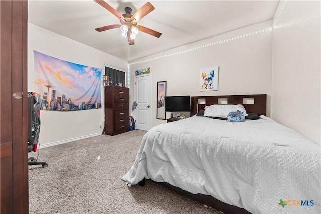 carpeted bedroom with baseboards, a ceiling fan, and a closet
