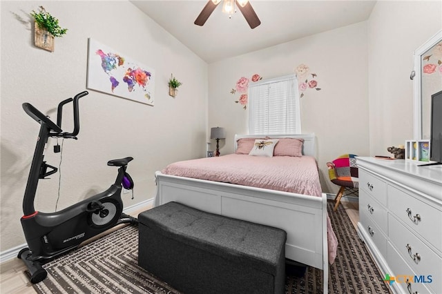 bedroom featuring vaulted ceiling, baseboards, and ceiling fan