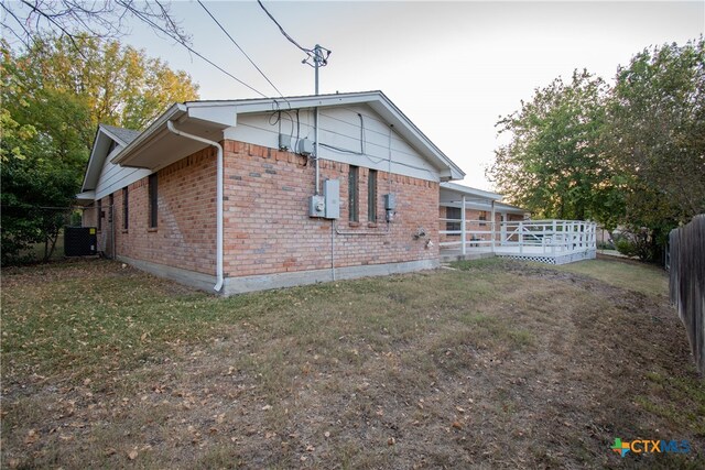 rear view of house with a lawn