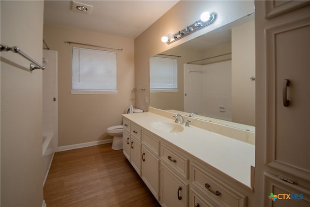 full bathroom with toilet, shower / bath combination, vanity, and wood-type flooring