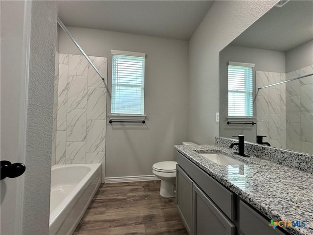3110 Gryffindor Ln, Killeen, TX 76549 - full bath featuring vanity, toilet, wood finished floors, shower / washtub combination, and baseboards