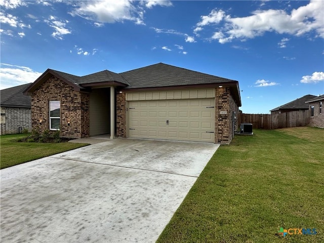 3110 Gryffindor Ln, Killeen, TX 76549 - view of front of property with concrete driveway, a garage, brick siding, central AC unit, and roof with shingles