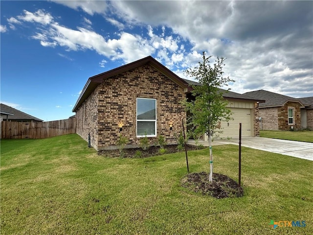 3110 Gryffindor Ln, Killeen, TX 76549 - view of front of home with driveway, brick siding, and a garage