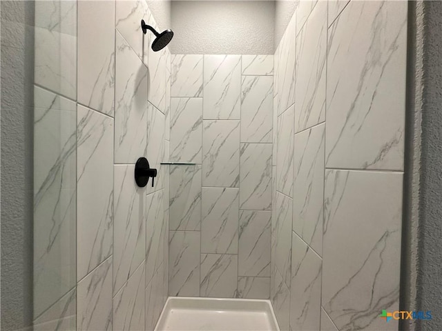 3110 Gryffindor Ln, Killeen, TX 76549 - bathroom with tiled shower and a textured wall