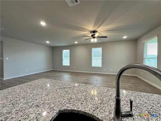 3110 Gryffindor Ln, Killeen, TX 76549 - empty room featuring plenty of natural light, wood finished floors, a ceiling fan, recessed lighting, and baseboards