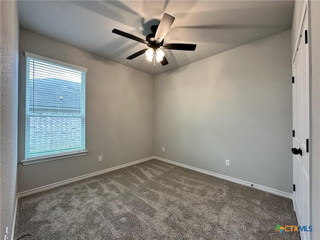 3110 Gryffindor Ln, Killeen, TX 76549 - empty room featuring ceiling fan, dark colored carpet, and baseboards