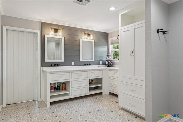 full bathroom featuring double vanity, visible vents, recessed lighting, wood walls, and ornamental molding