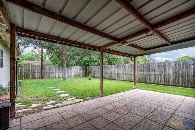 exterior space featuring central air condition unit and a fenced backyard