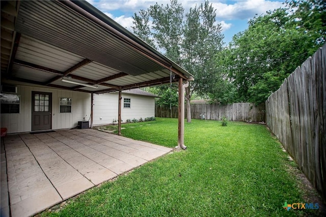 view of yard with a fenced backyard and a patio
