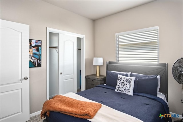 bedroom featuring a closet and carpet