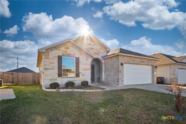 ranch-style home with a front yard and a garage